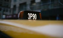 Modern yellow taxi roof with number sign on black background
