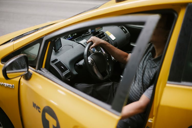 Taxi Driver Sitting In Car