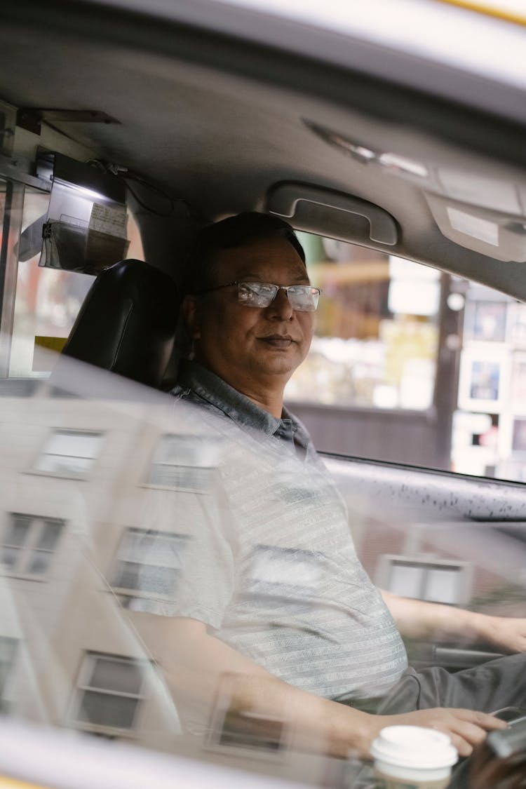 Pensive Man Sitting In Car