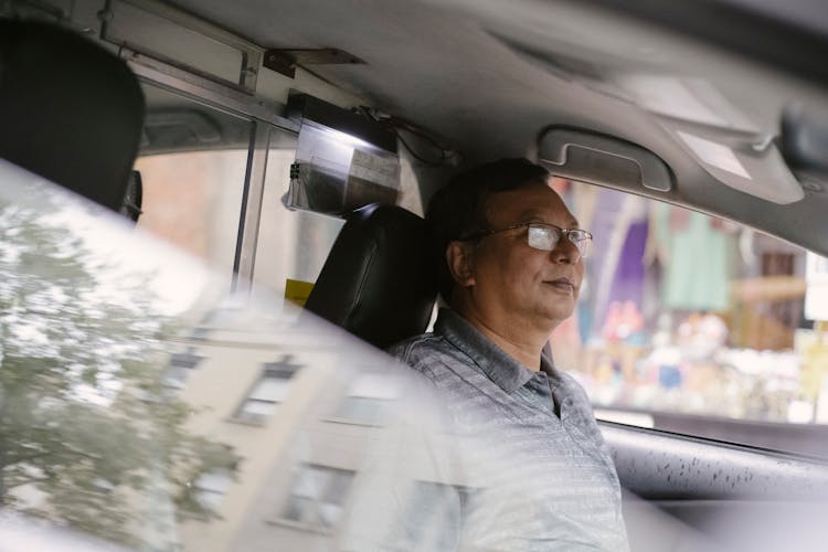 Calm Ethnic Driver In Car