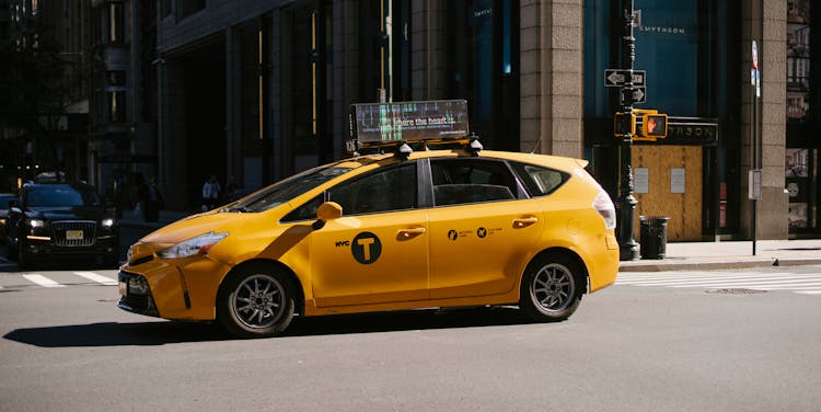 Taxi Car On Asphalt Road