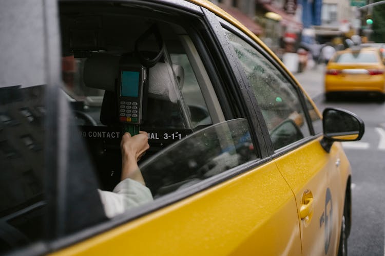 Anonymous Person Paying For Taxi Ride By Credit Card