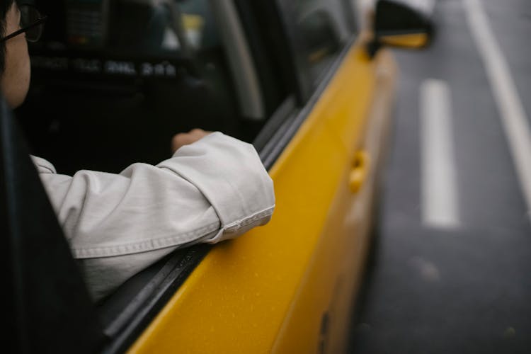 Faceless Male Passenger Sitting In Taxi