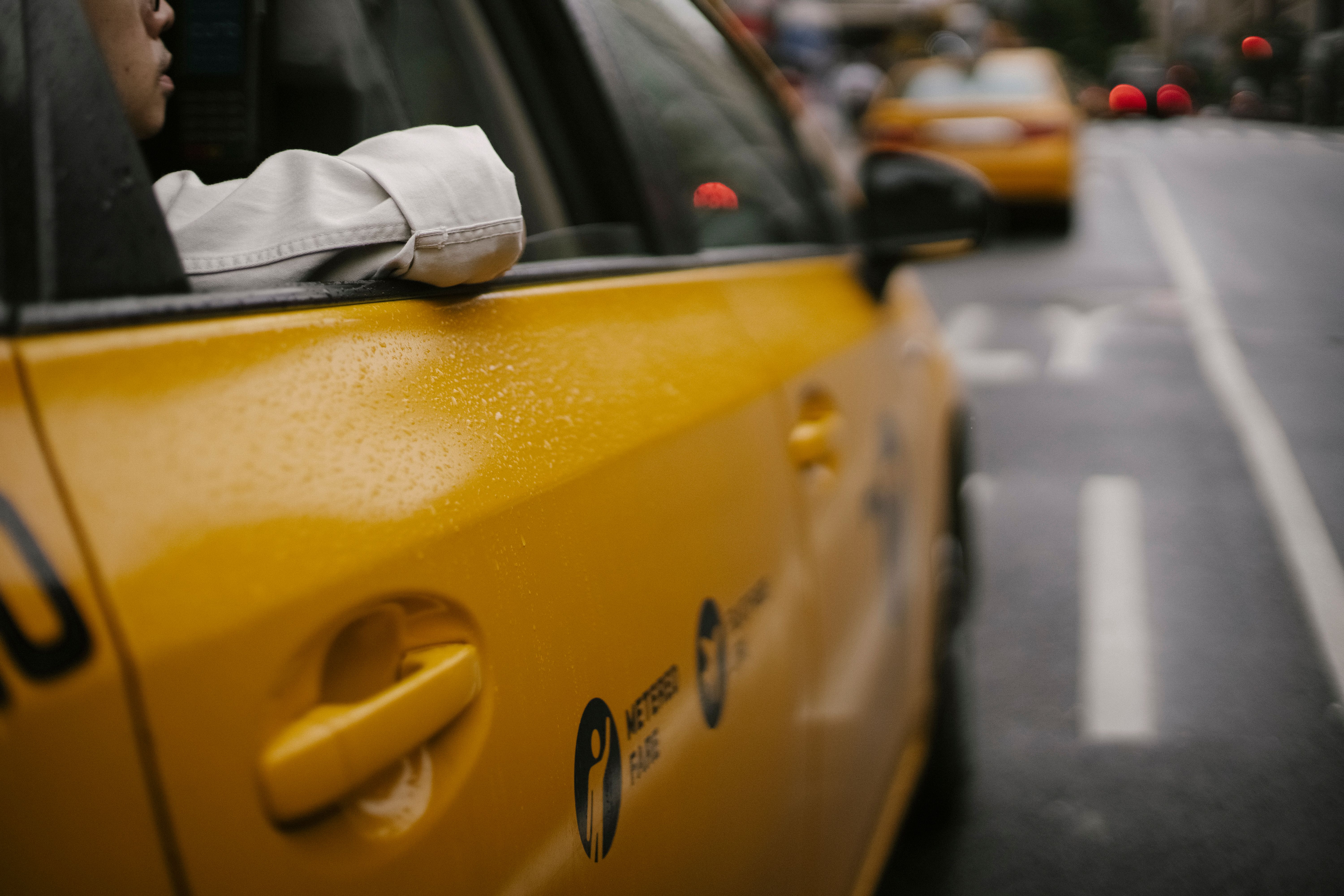 Photo by Tim  Samuel: https://www.pexels.com/photo/unrecognizable-man-sitting-in-colorful-taxi-5835289/
