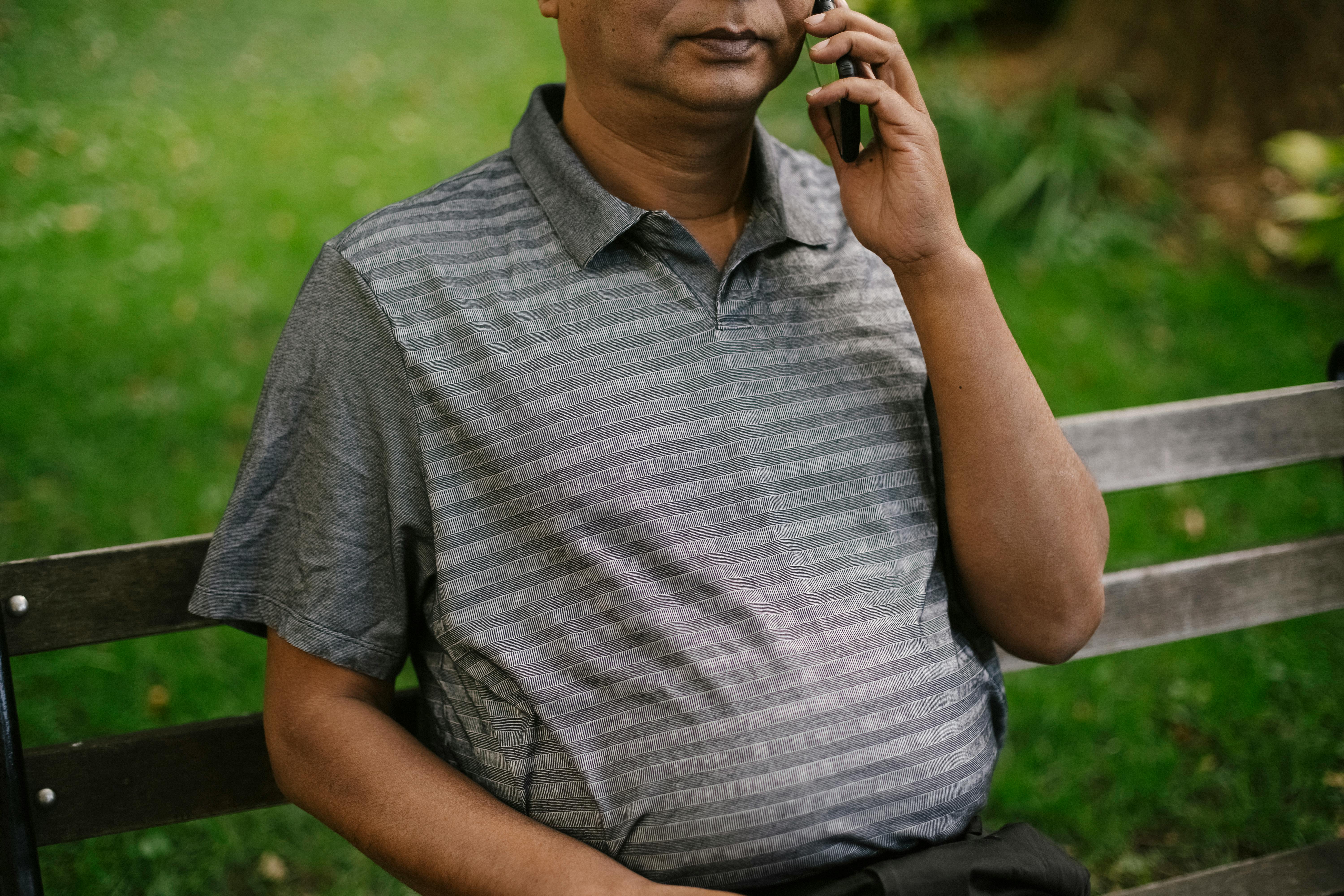 male talking on phone in park