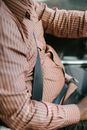 Faceless ethnic driver in ornamental shirt in transport