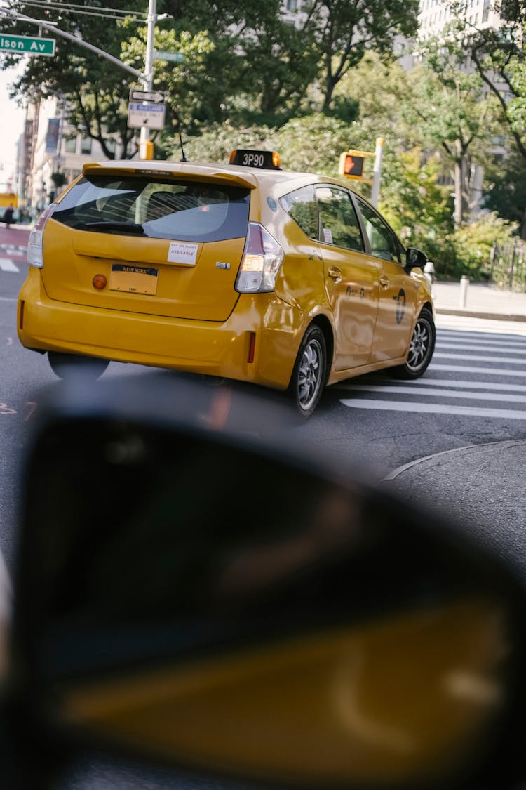 Contemporary Bright Taxi Car On City Road