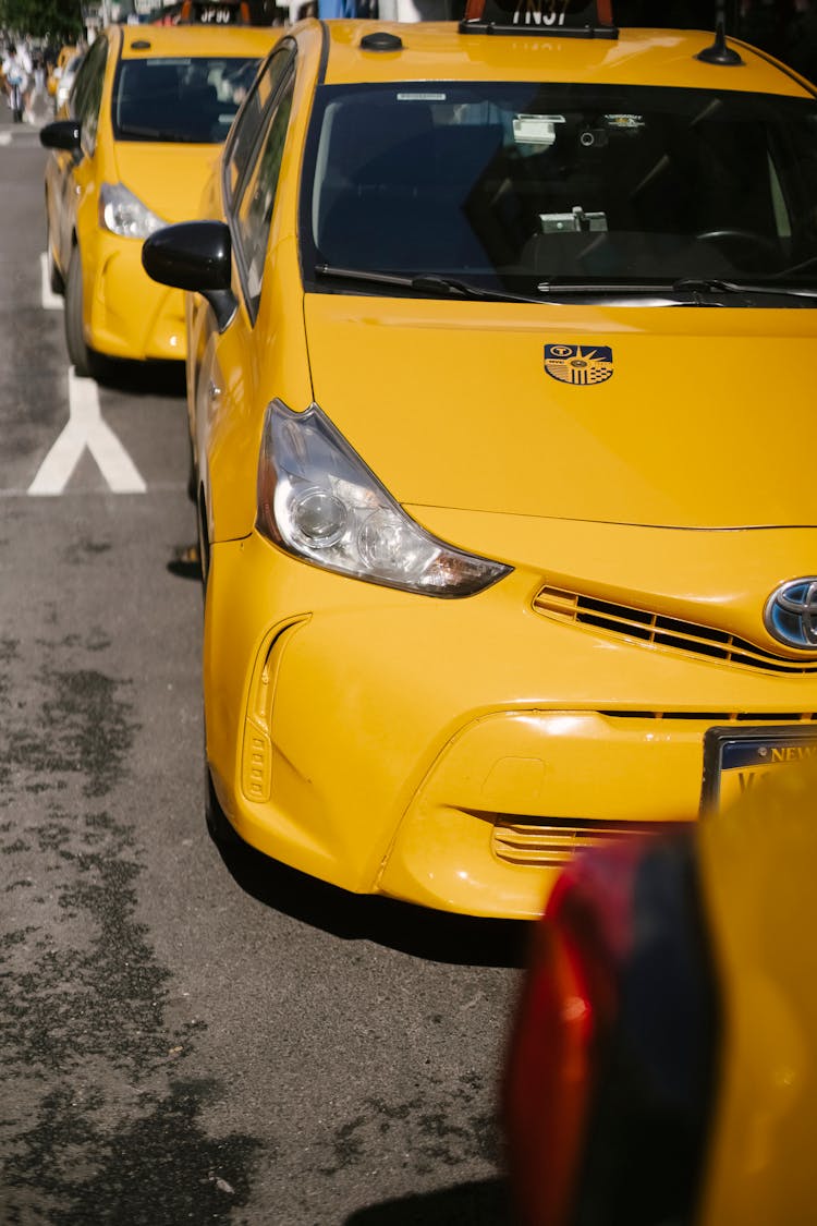 Colorful Luxury Taxi Autos On Asphalt Road