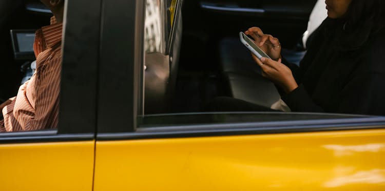 Crop Passenger And Driver In Taxi