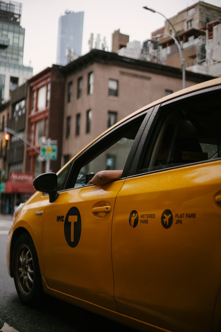 Faceless Person Driving Taxi On Street