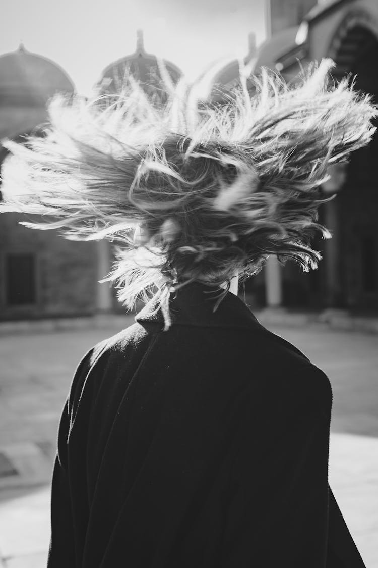 Grayscale Photo Of Woman With Flying Hair