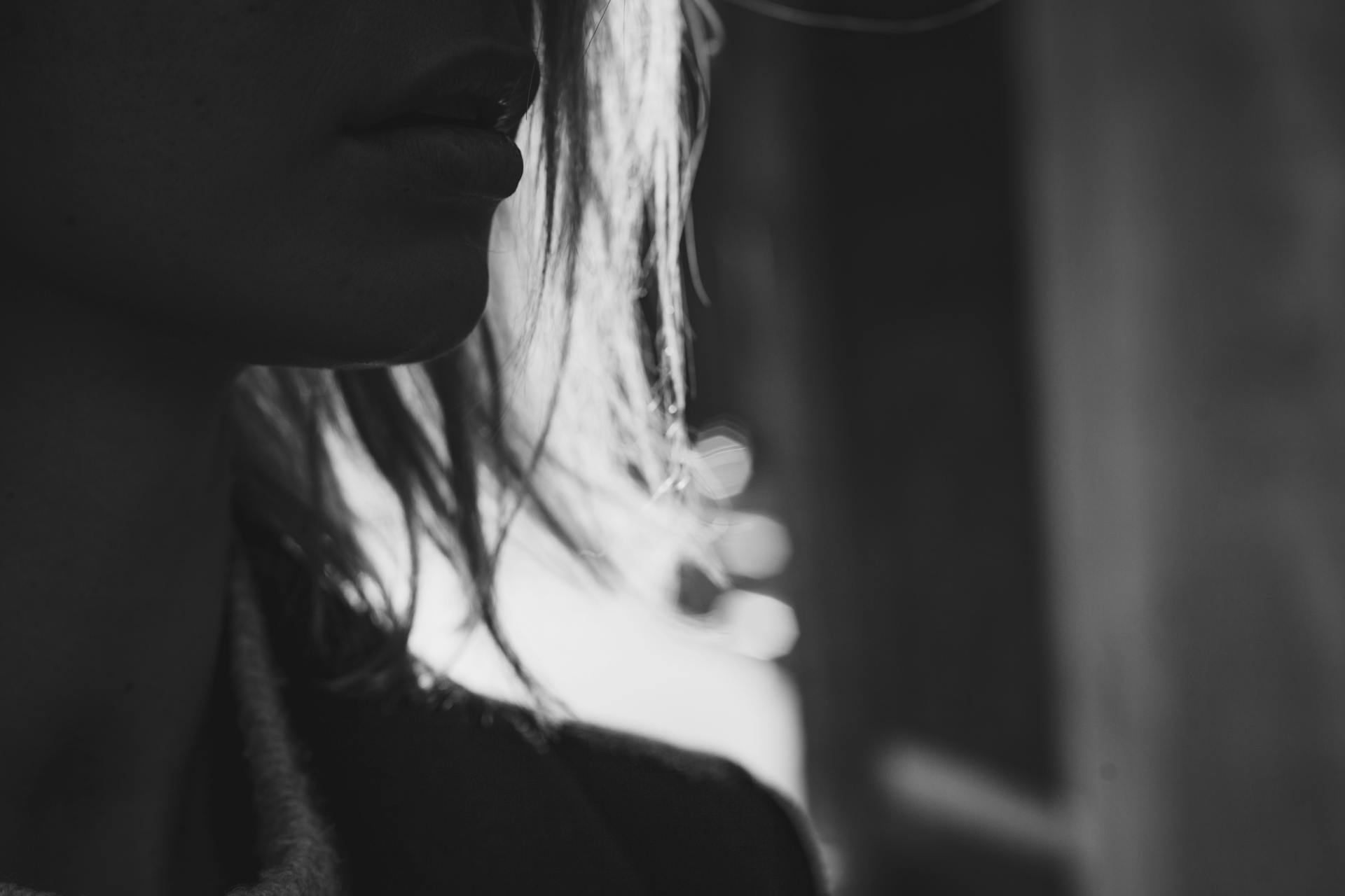 Grayscale Close-up Photo of the Chin of a Woman