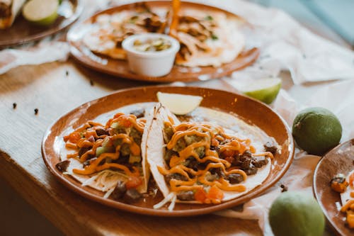 Cheesy Tacos on Brown Round Plate