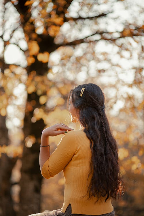 Woman in Yellow Shirt with Hand on Shoulder