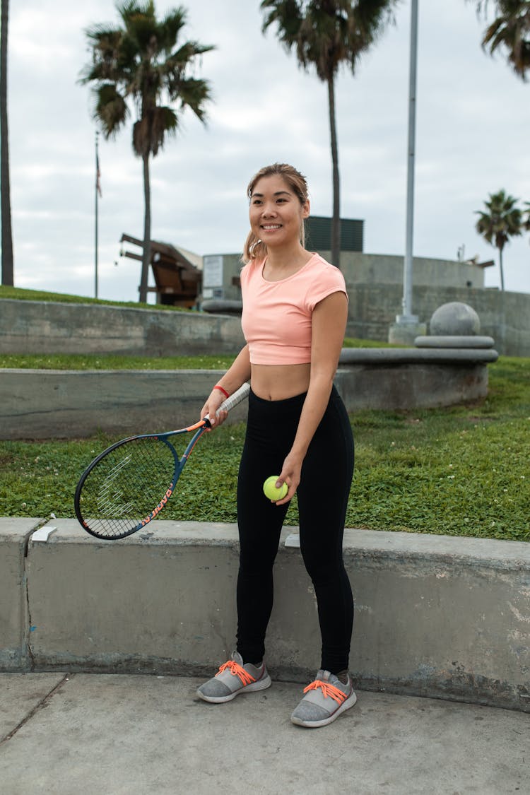 Woman In Crop Top Playing Tennis