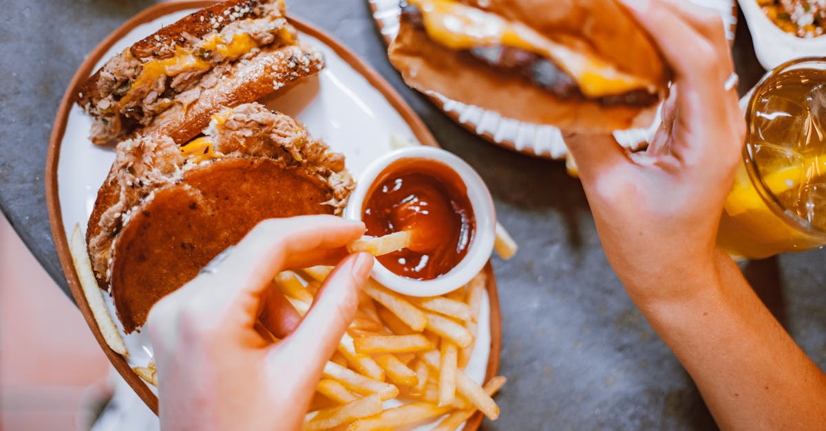Mouth-watering fast food meal featuring burgers, fries, and refreshing drinks.