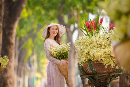 Pretty Woman Holding a Bunch of Flowers