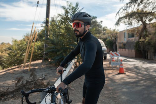 Free A Cyclist in Black Long Sleeve Jersey and Cycling Shorts Stock Photo