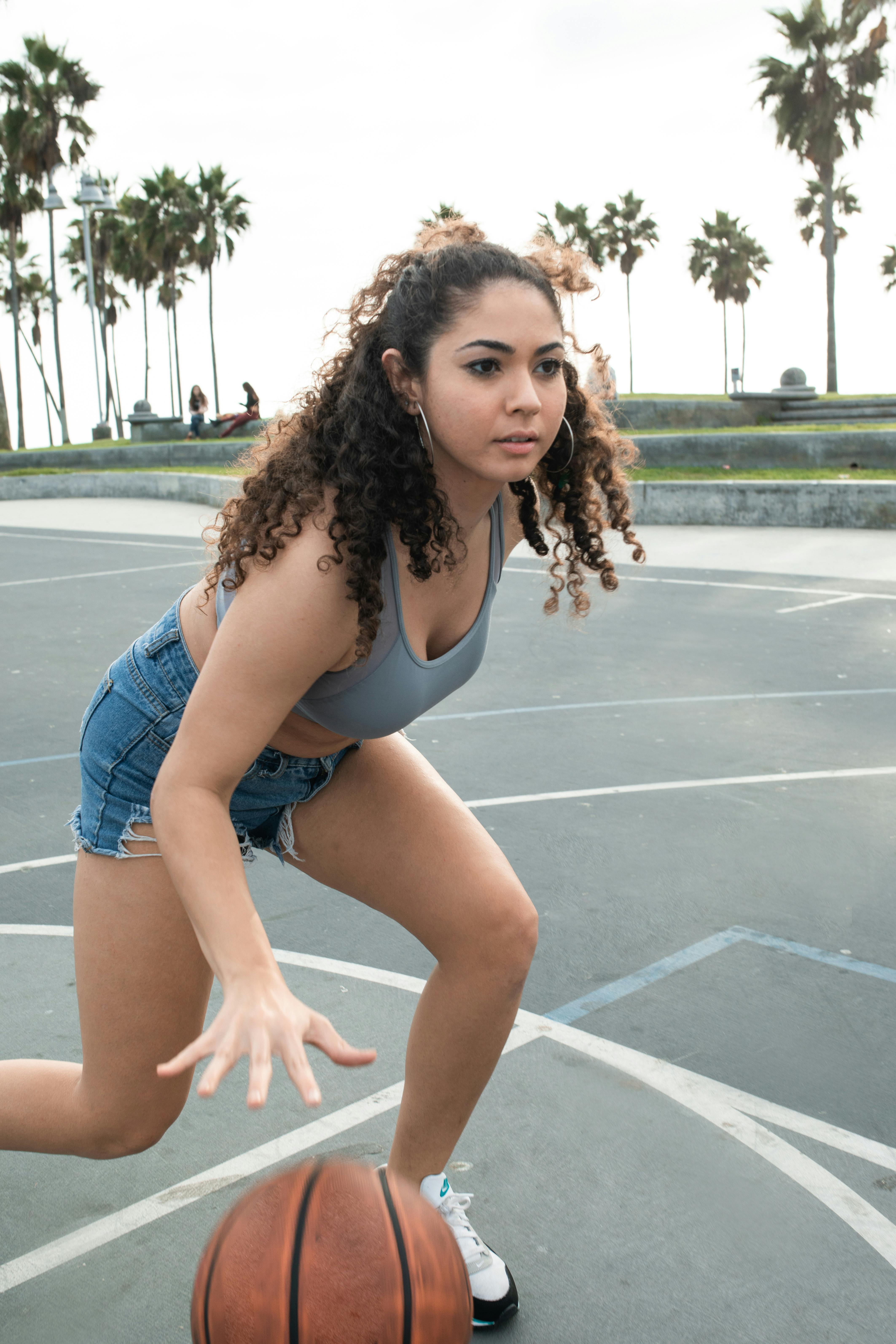 a woman playing basketball