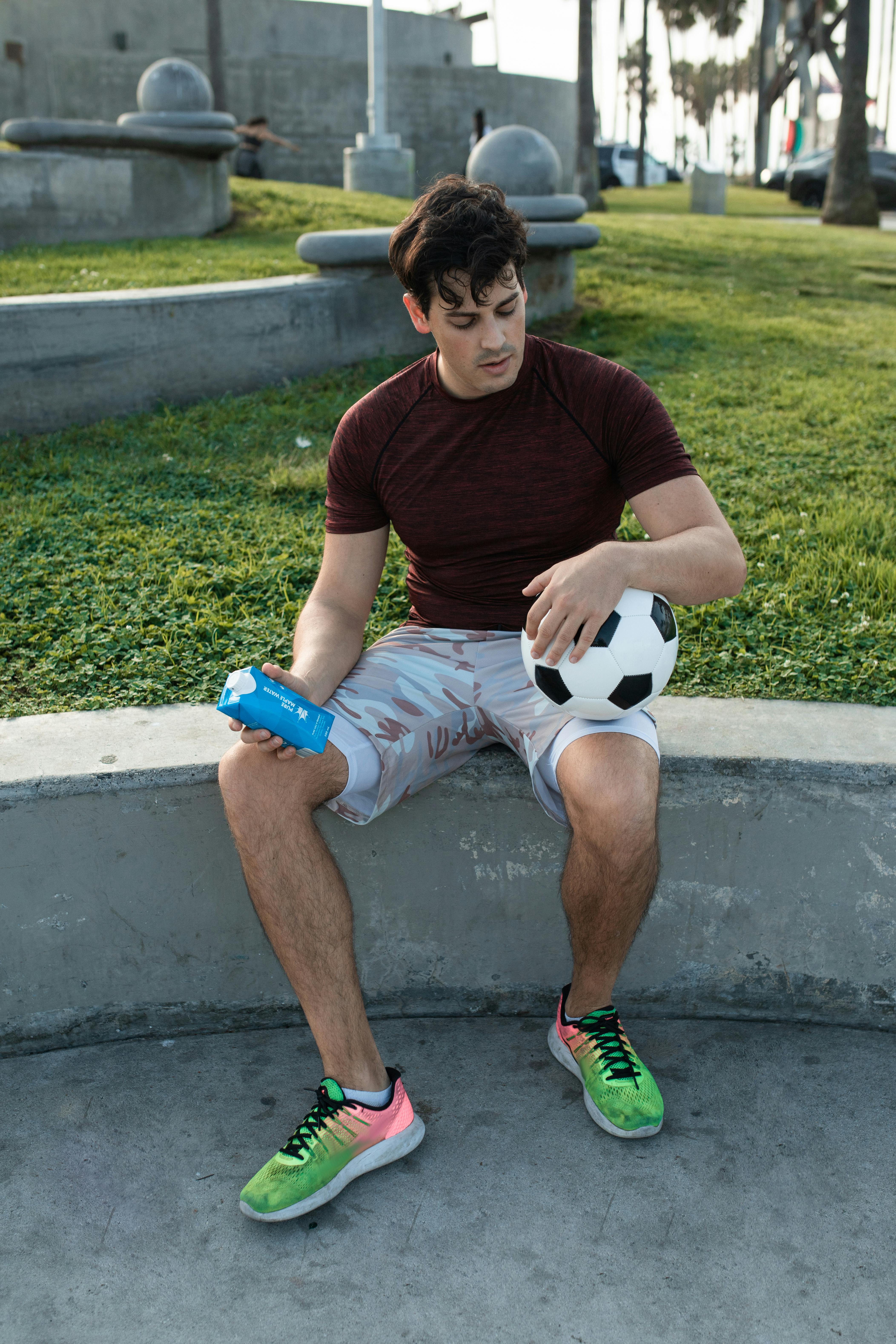 a man holding a soccer ball