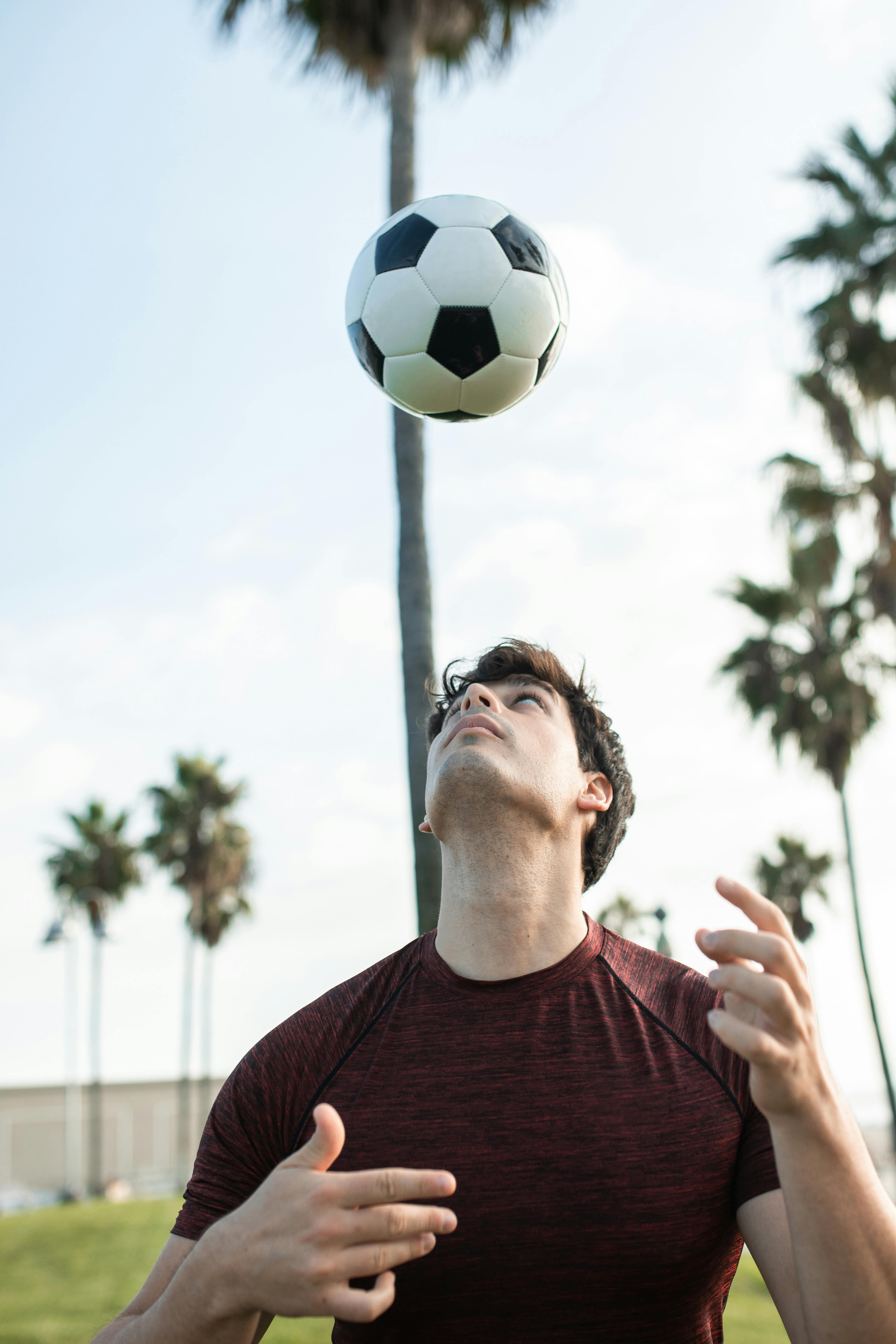 a man playing with the soccer ball