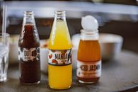 Flavored Juices in a Glass of Bottle