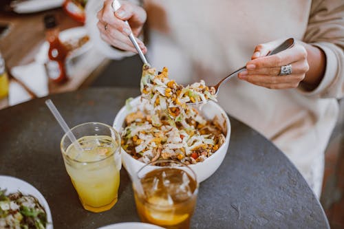 A Person Having a Bowl of Salad for Lunch