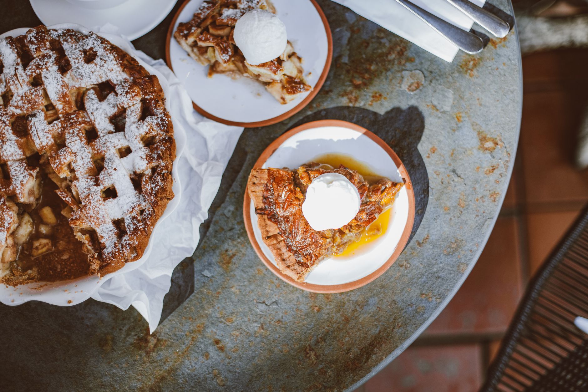 Top view of apple pie slices with vanilla ice cream, perfect for dessert lovers.