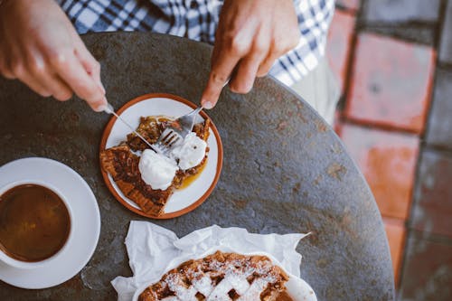 A Person Eating a Pie with Cream Cheese