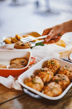 Delicious homemade chocolate chip cookies being served with tongs.
