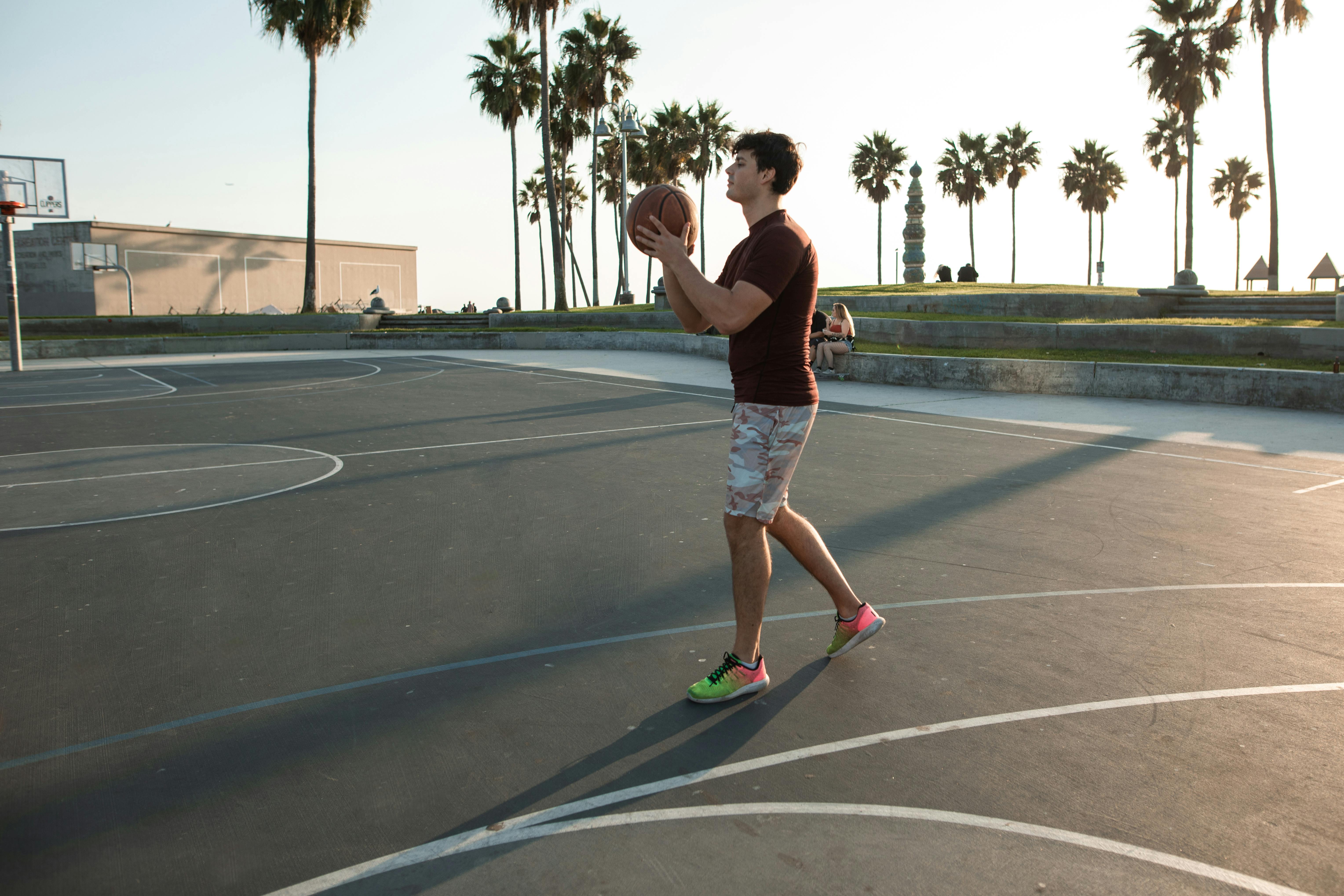 Two People Playing Basketball on Basketball Court · Free Stock Photo