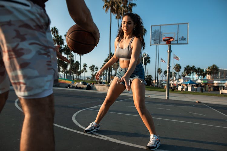 A Woman In Playing Basketball