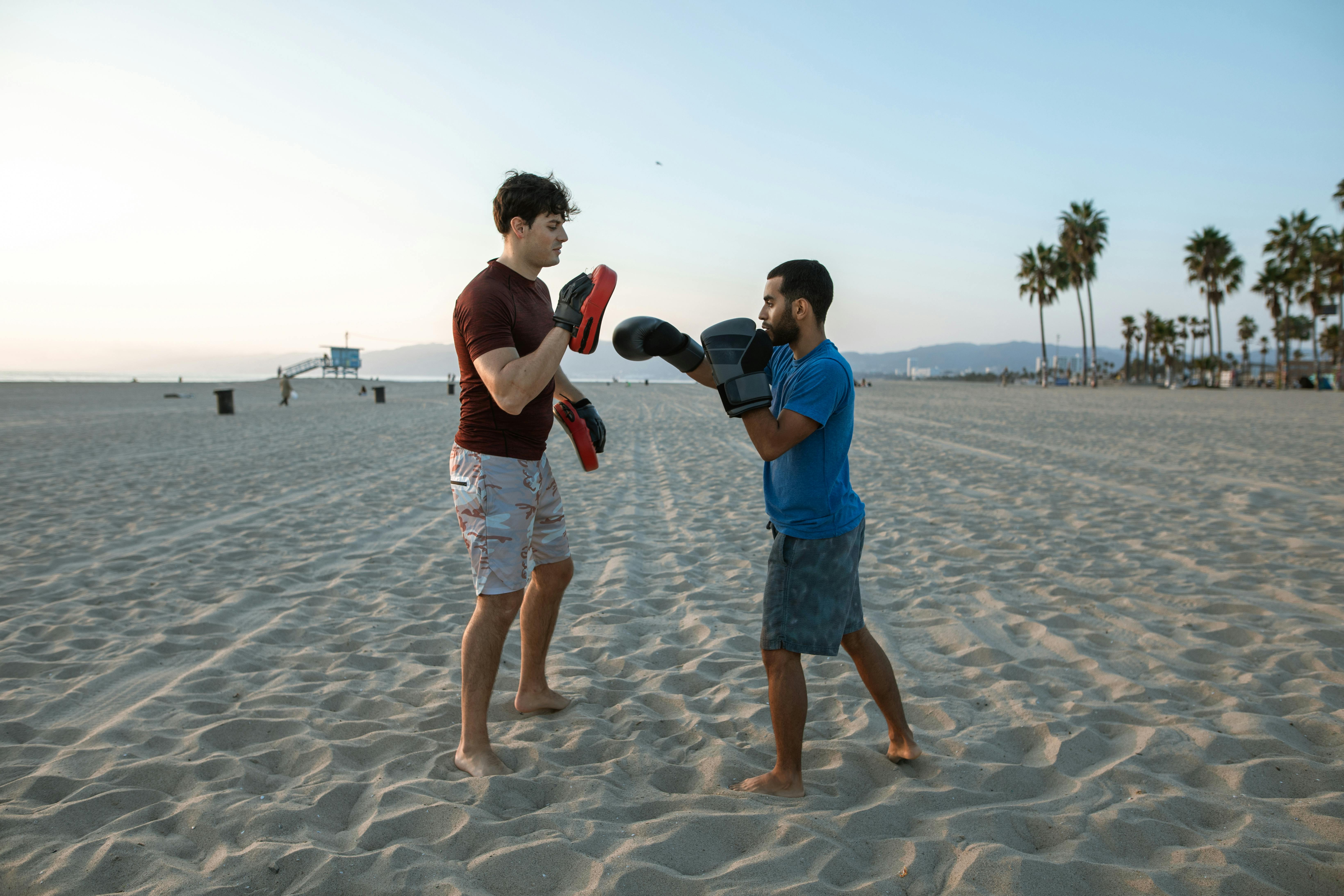 a man training another man in boxing