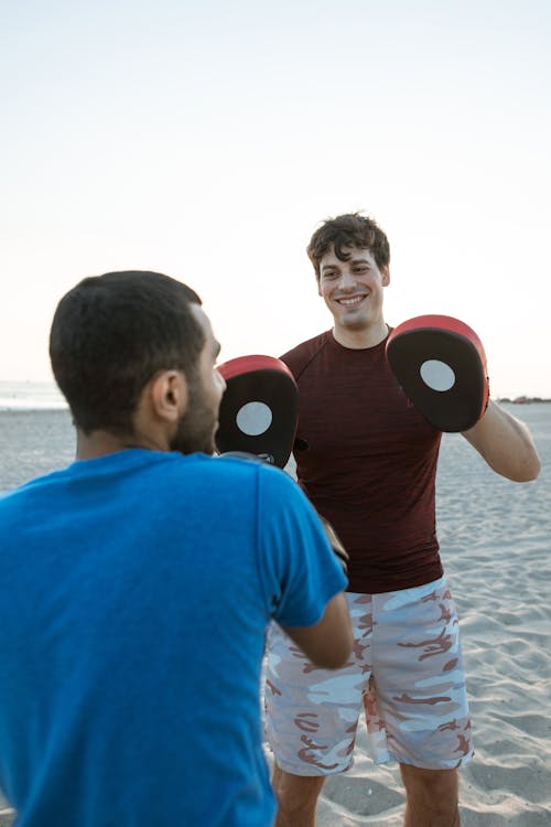 Men Working Out Punches in the Beach with 