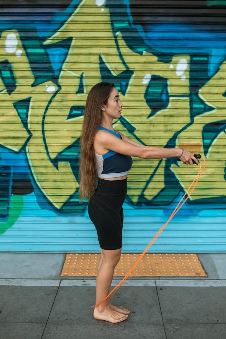 A Woman Using A Jump Rope