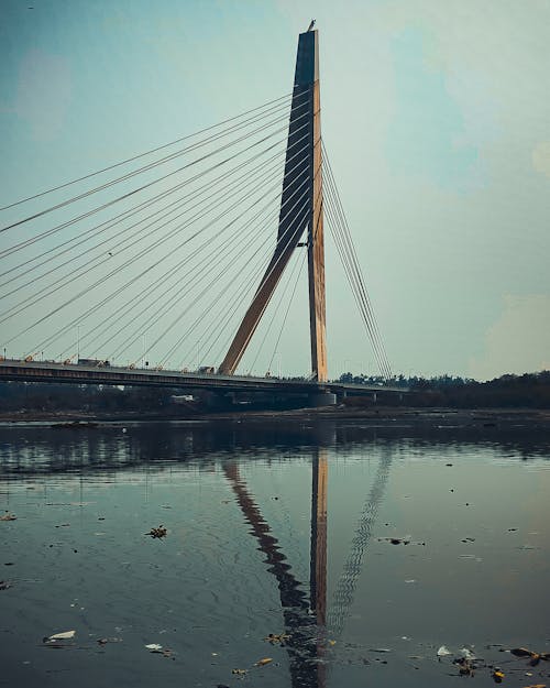 Suspension Bridge Over Polluted River