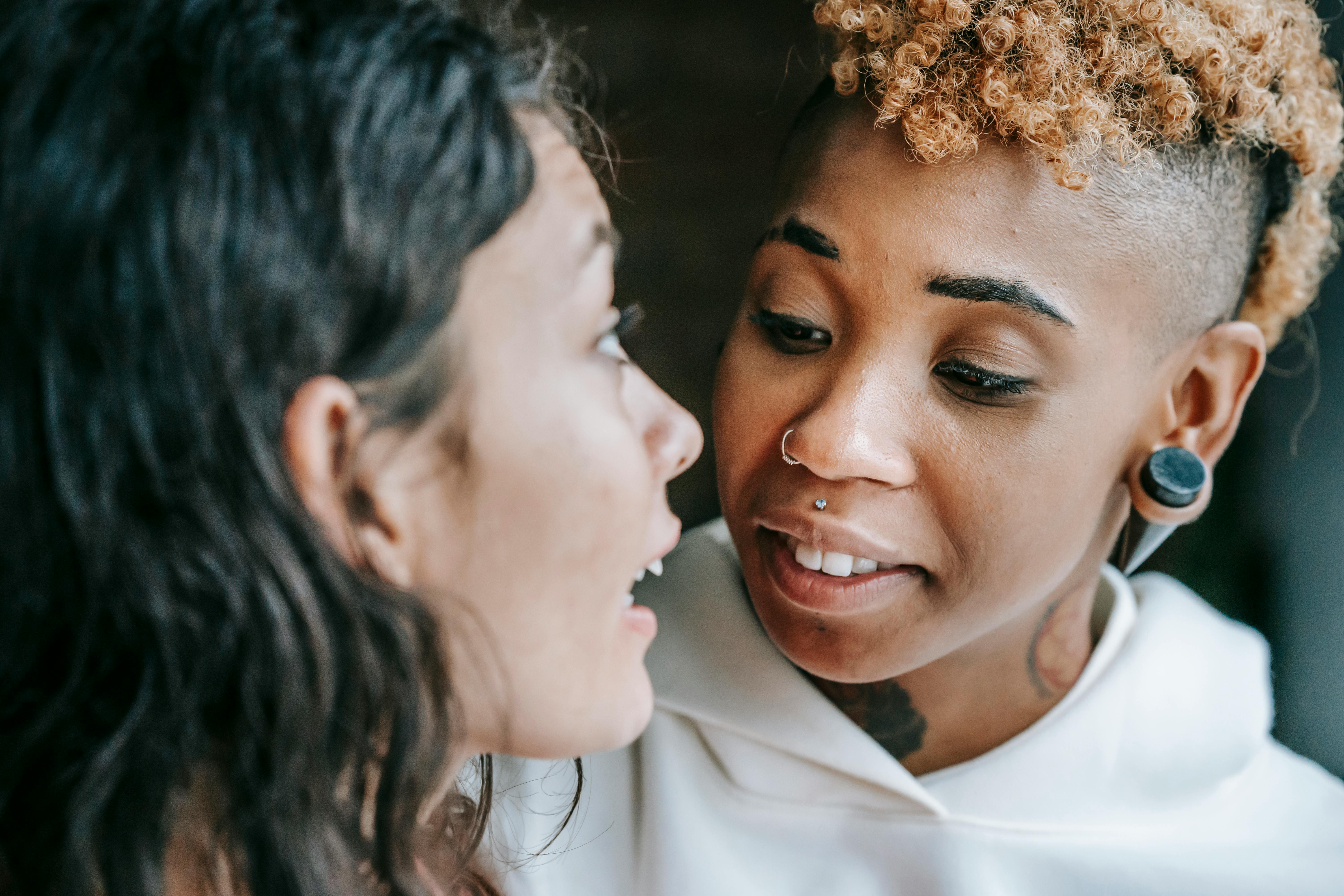 crop multiethnic content girlfriends chatting and standing close