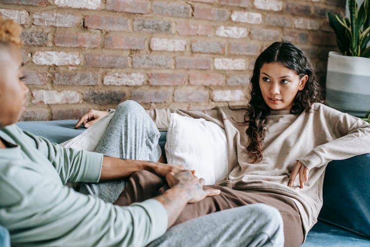 Diverse Couple On Couch At Home