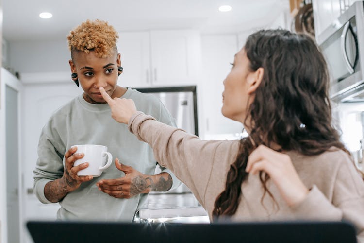 Cheerful Couple Having Fun In Kitchen