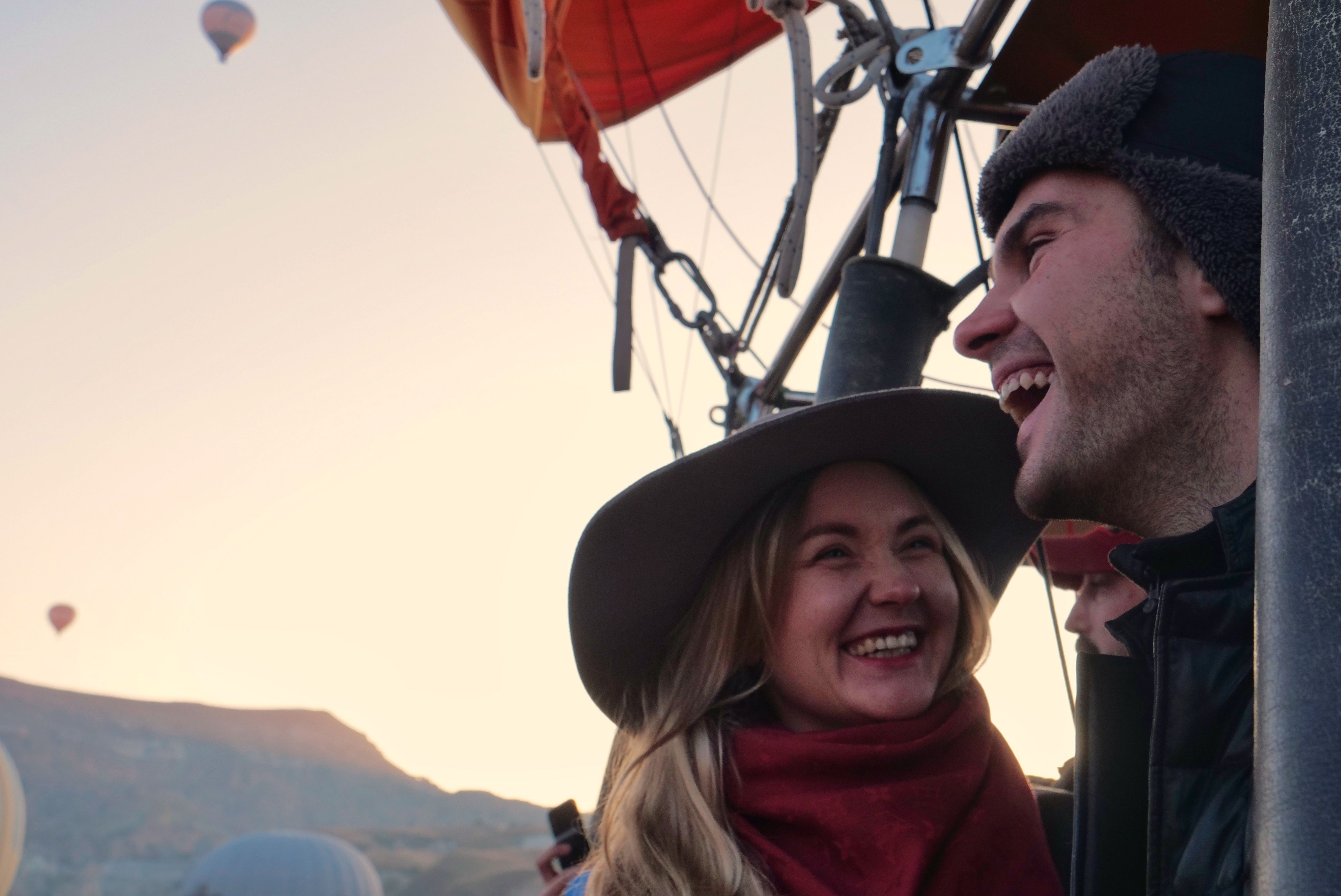 Overjoyed Couple in Hot Air Balloon in Sky · Free Stock Photo