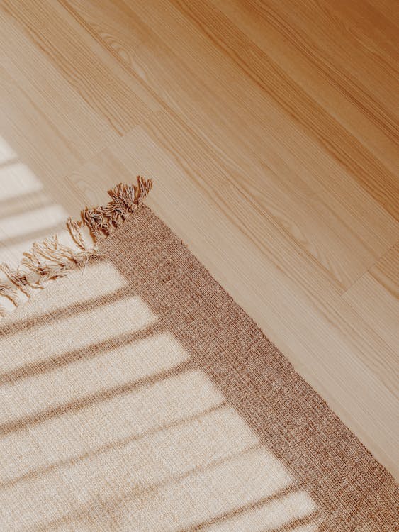 Free A Brown rug on the Wooden Floor Stock Photo