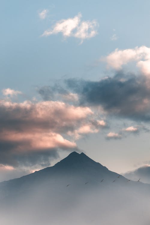 Free White Clouds over Mountain Stock Photo