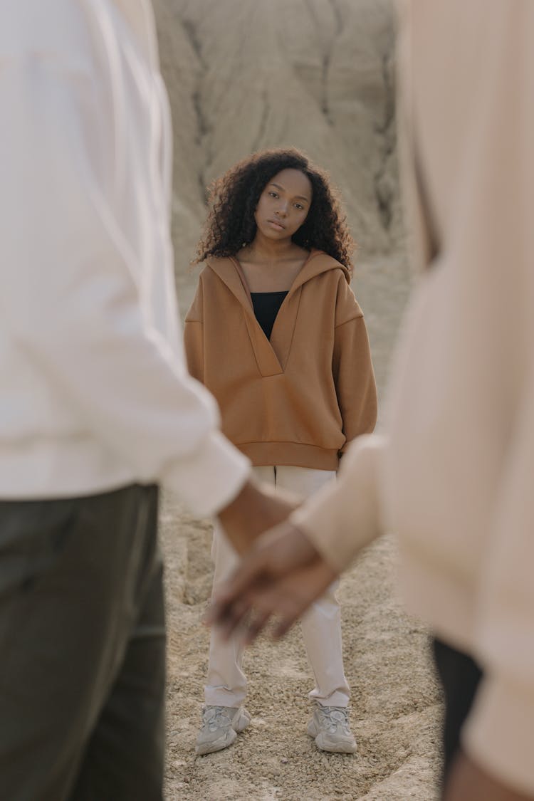 A Woman In Brown Hoodie