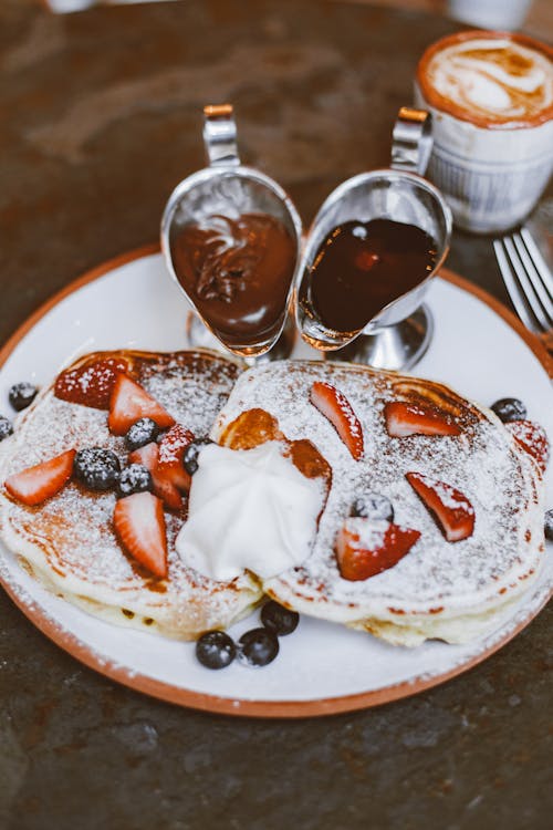 Free Pancakes with Fruit Toppings on a Plate Stock Photo