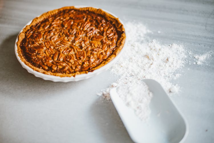 Baked Pecan Pie On A White Surface 