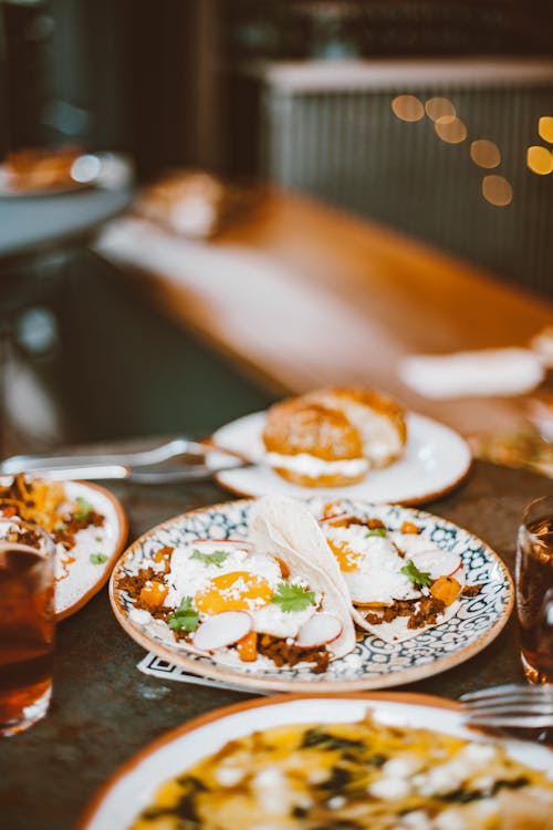 Free Brown and White Pastry on White and Blue Floral Ceramic Plate Stock Photo