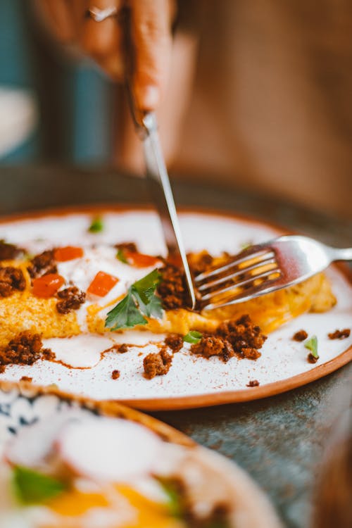 Free Knife and Fork on a Plate of food Stock Photo