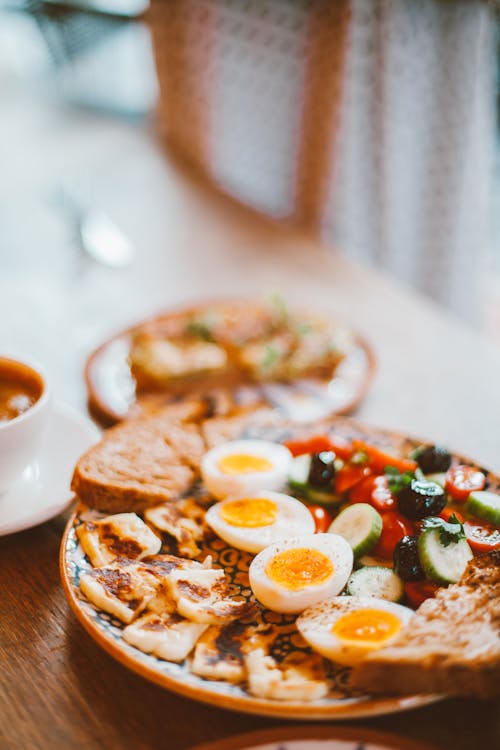 Free Boiled Eggs, Bread and Vegetables on a Plate  Stock Photo