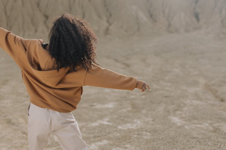 Woman In Brown Hoodie