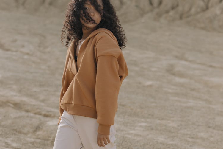 A Woman In Brown Hoodie